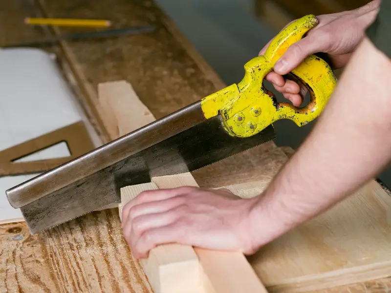 Professional carpenter in Dubai crafting custom wooden furniture